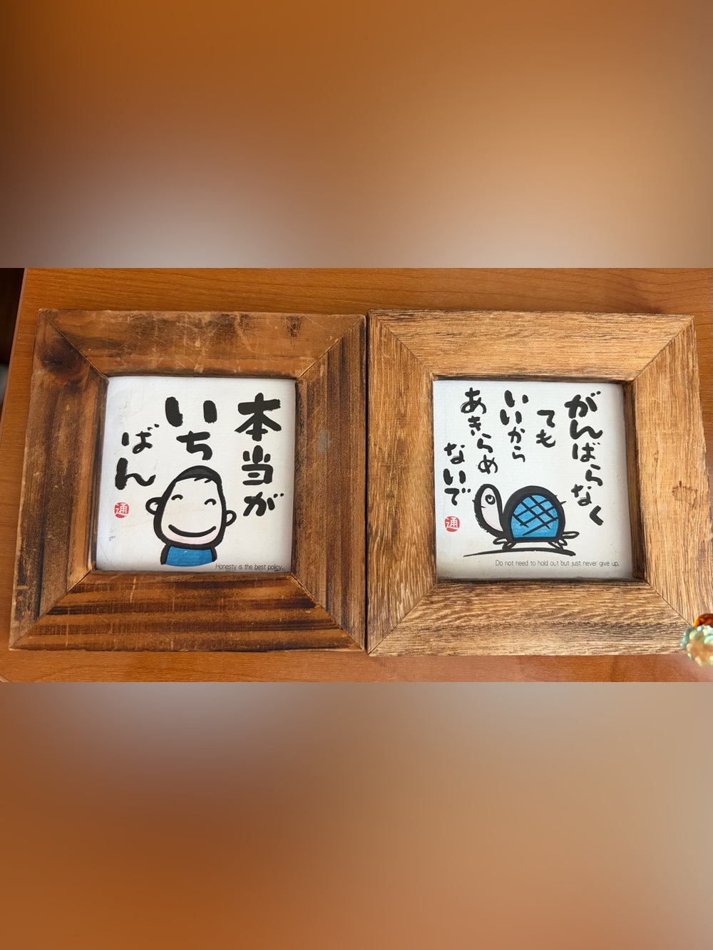 Japanese calligraphy wall art prints with natural wooden frames.